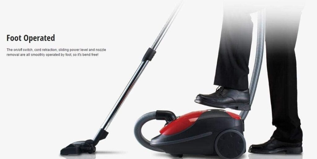 Person operating the red Panasonic MC-CG717 vacuum cleaner controls by foot without bending over